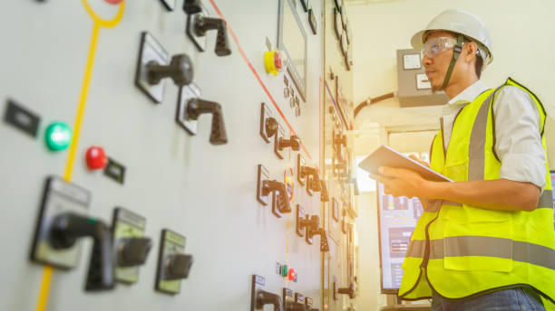 istock Experienced electrician working in power plant control room. Engineer working on the checking status switchgear electrical energy distribution substation. 1397682887
