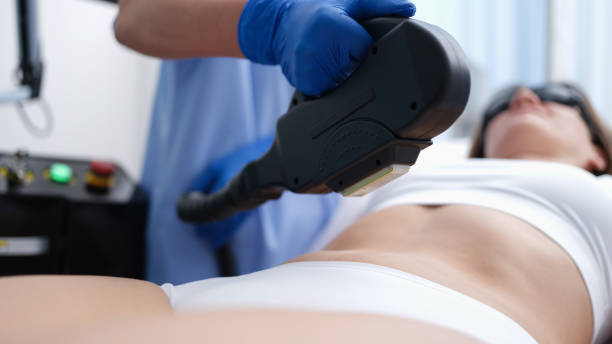 istock Cosmetologist removing unwanted hair from client body using laser closeup 1397682995