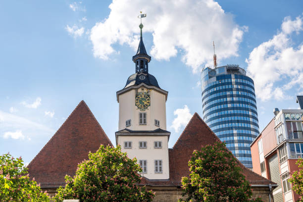town hall of Jena in Thuringia, GermanyIntershop Tower in the backgroundJena is a university city in central Germany on the river Saale. Jena is a manufacturing city, specializing in precision machinery, pharmaceuticals, optics and photographic equipment