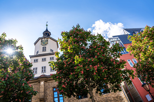 town hall of Jena in Thuringia, Germany\nIntershop Tower in the background\n\nJena is a university city in central Germany on the river Saale. Jena is a manufacturing city, specializing in precision machinery, pharmaceuticals, optics and photographic equipment
