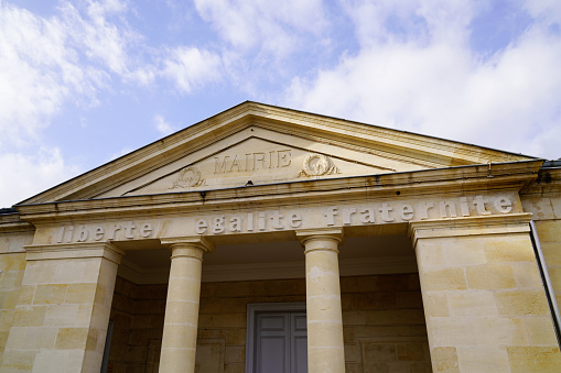 city hall in center france stone building with french text liberte egalite fraternite mairie means liberty equality fraternity town hall