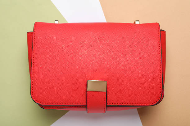 istock Stylish women's bag on color background, top view 1397686231