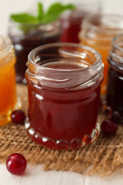 istock Jar of sweet jam on table, closeup 1397686582