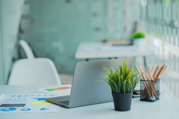 istock Financial graph document and laptop with a calculator, notebook on the desk, business research workplace. 1397686932