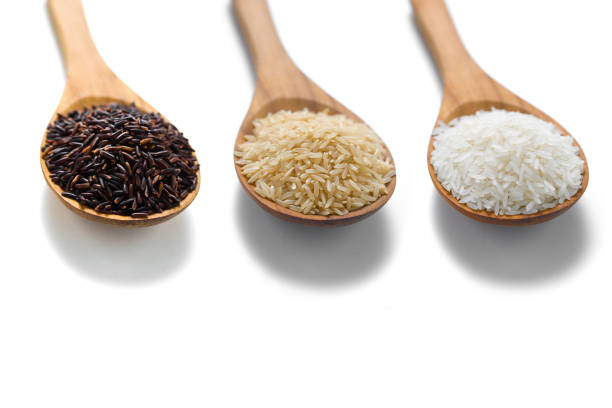 istock Three types of rice in the wooden spoons 1397688361