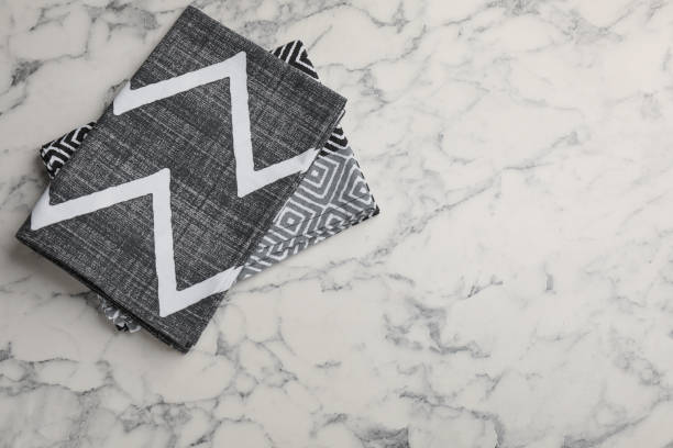 istock Beautiful kitchen towels on white marble table, top view. Space for text 1397691258