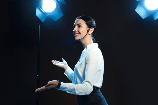 Motivational speaker with headset performing on stage