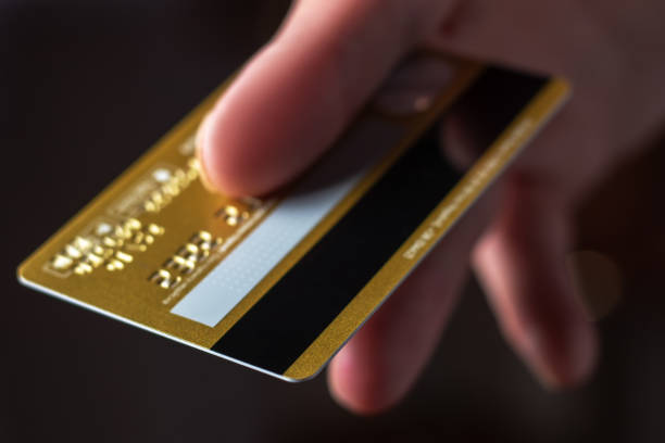 istock Man hand with credit card for pay close up 1397692465
