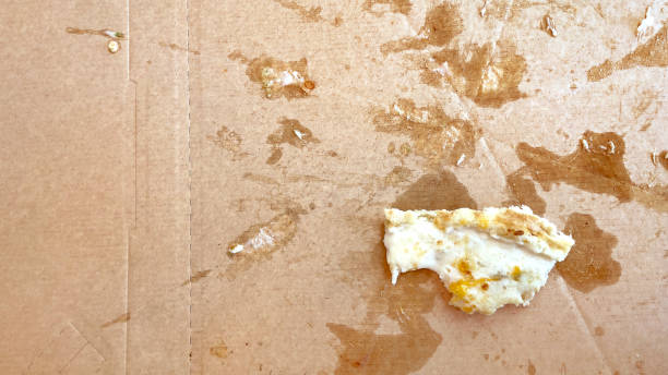 istock pizza leftovers on the background of a cardboard box 1397693535