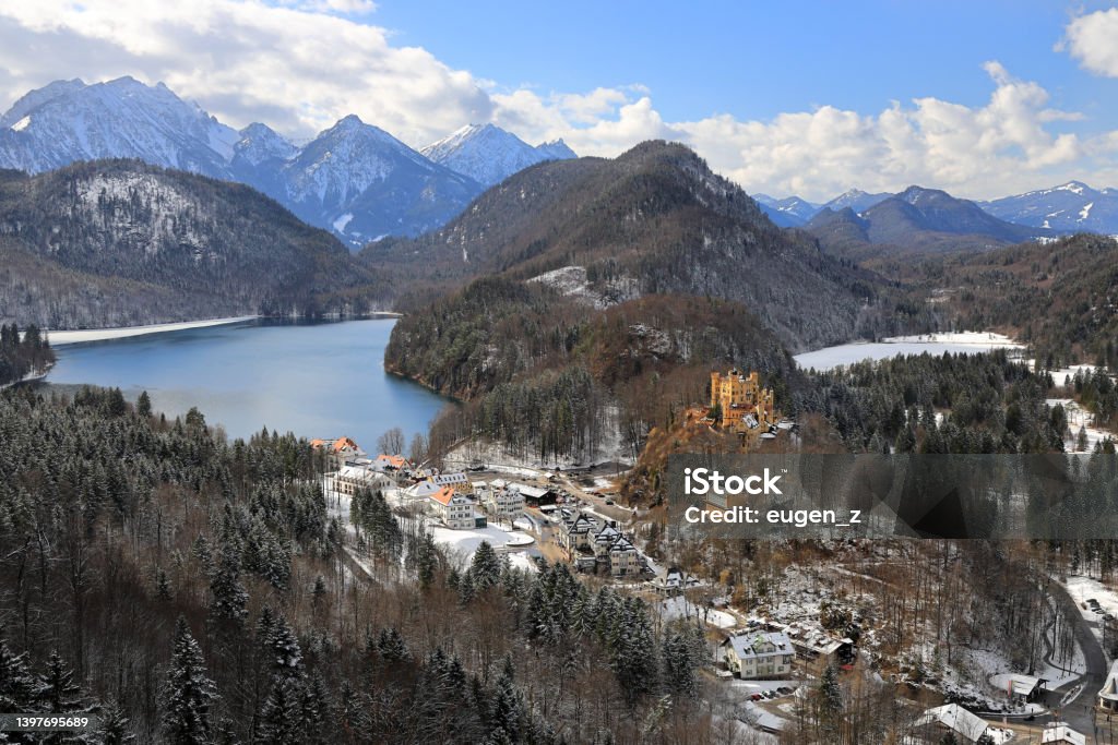 Panorama view on Alpsee lake with Hohenschwangau castle. Bavaria, Germany, Europe. The Alpsee is a lake in the Ostallgäu district of Bavaria, Germany, located about 4 kilometres southeast of Füssen. It is close to the Neuschwanstein and Hohenschwangau castles. Neuschwanstein Castle Stock Photo