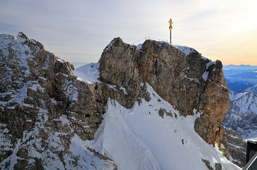 The Zugspitze at 2,962 m (9,718 ft) above sea level, is the highest peak of the Wetterstein Mountains as well as the highest mountain in Germany. It lies south of the town of Garmisch-Partenkirchen, and the Austria-Germany border runs over its western summit.