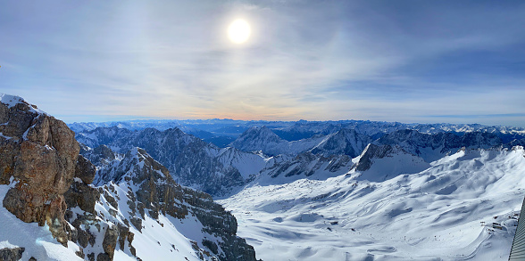 Aerial view of a snowy winter landscape and perfect conditions in ski resort in the morning. Panorama photographed in Brandnertal, Vorarlberg, Austria.