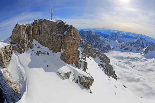 The Zugspitze at 2,962 m (9,718 ft) above sea level, is the highest peak of the Wetterstein Mountains as well as the highest mountain in Germany. It lies south of the town of Garmisch-Partenkirchen, and the Austria-Germany border runs over its western summit.