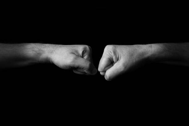 istock Left and Right Facing Fists emoji isolated on black background 1397696104