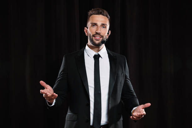 istock Motivational speaker with headset performing on stage 1397696173
