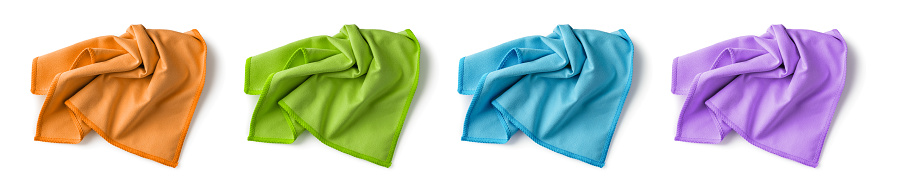 Crumpled colorful microfiber cloth set isolated on white background. Multicolored soft microfiber napkins for household chores. Housework, cleaning and purity equipment tool concepts. Top view.