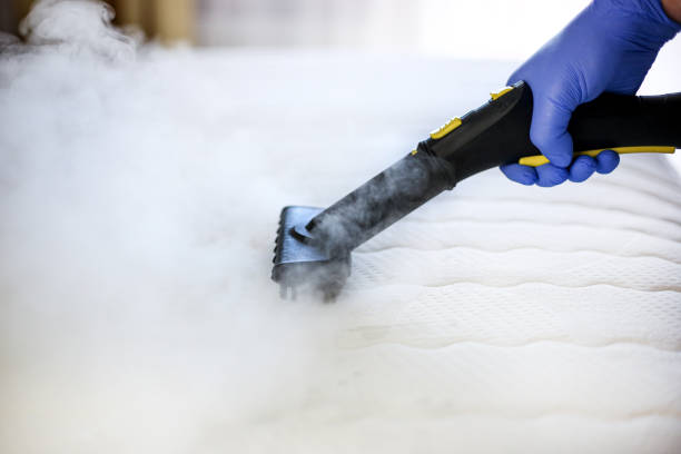 Cleaning and disinfection of the mattress in the bedroom with hot steam. Professional cleaning process Cleaning and disinfection of the mattress in the bedroom with hot steam. Professional cleaning process mattress stock pictures, royalty-free photos & images