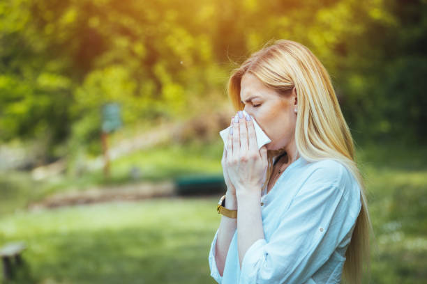 istock Woman Blowing Her Nose 1397696393
