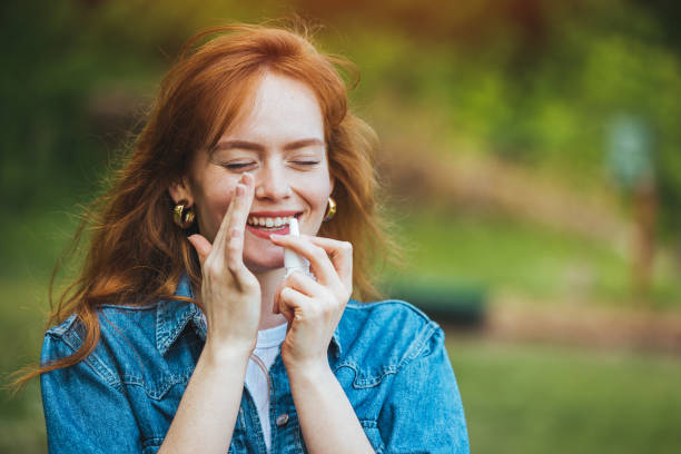 istock Young Woman is Having Sinusitis Problems Outside in Nature. 1397696797