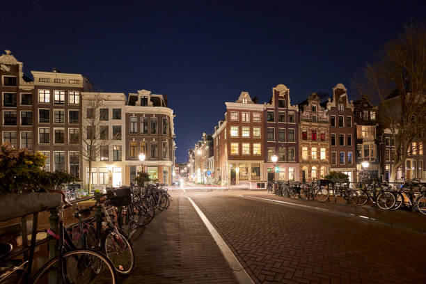 istock Amsterdam city street at night 1397697030