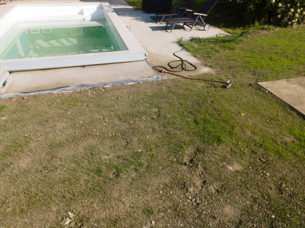 istock Drone flight over pool in the middle of greenery, fresh grass grown 1397697053