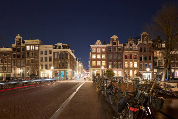 istock Amsterdam city street at night 1397697076