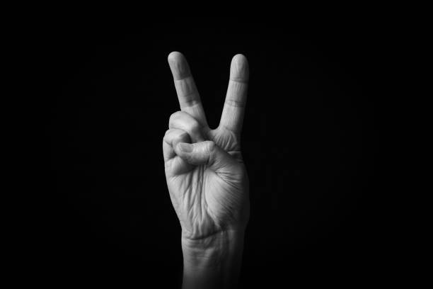 istock Victory Hand emoji isolated on black background 1397697092