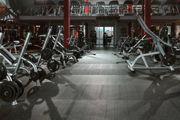 istock Gym without people with large group of exercise machines. 1397697126