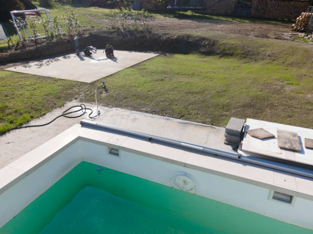 istock Drone flight over pool in the middle of greenery, fresh grass grown 1397697280