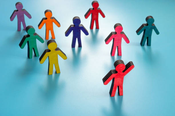 istock Leadership and inclusion. Colorful figurines on the surface. 1397697672