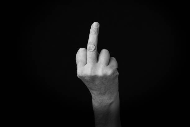 istock Middle Finger emoji isolated on black background 1397697753