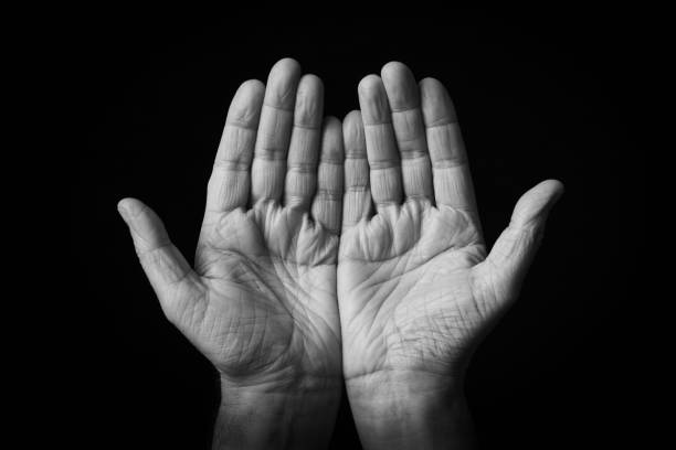 istock Palms Up Together emoji isolated on black background 1397697851