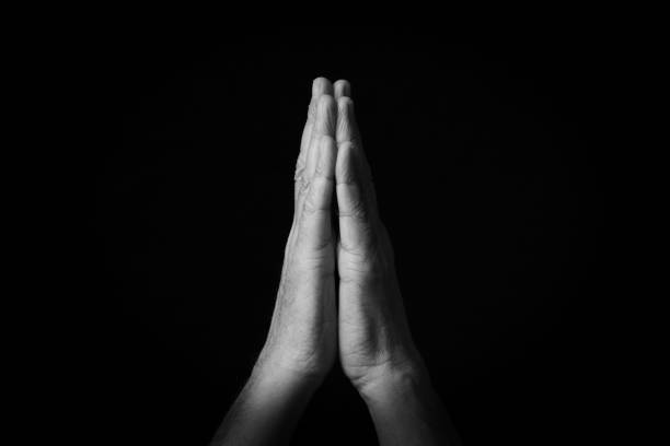 istock Folded Hands emoji isolated on black background 1397697852