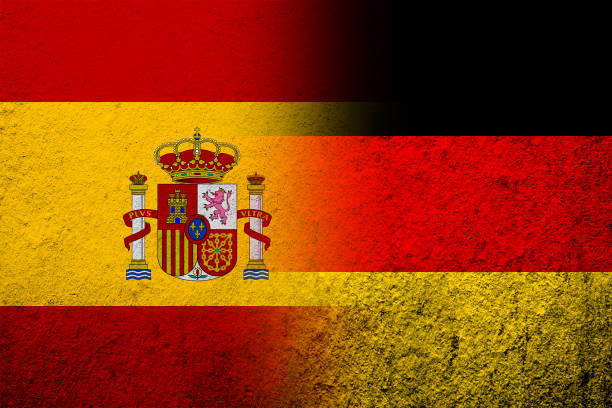 the national flag of germany with kingdom of spain national flag. grunge background - spain germany stock illustrations