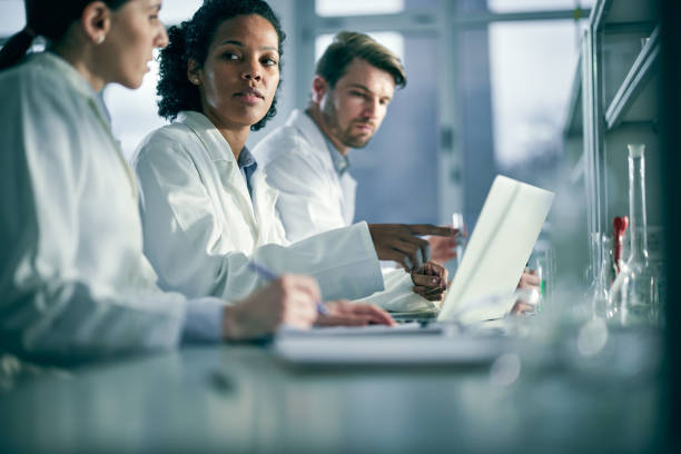 istock Team of young scientists working on a computer in laboratory. 1397700361