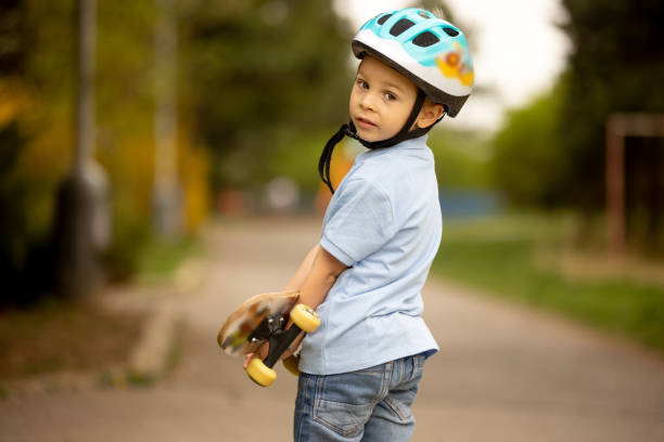 istock Little boy, riding skateboard in the park 1397700837