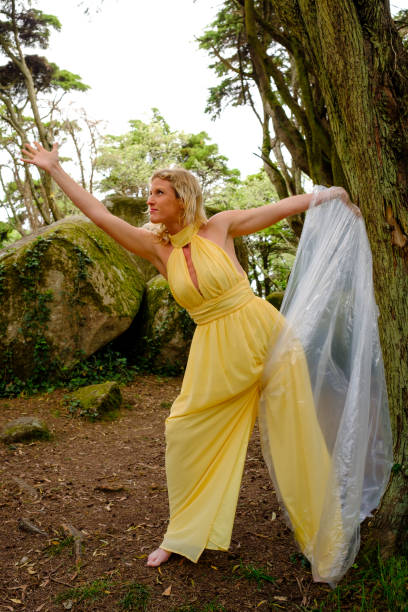 Yellow fairy representing the wind element and the recycling of plastic already released from the plastic bag