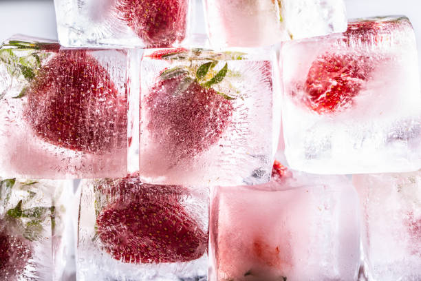 istock Fresh strawberries frozen in ice cubes - Close up. 1397704372