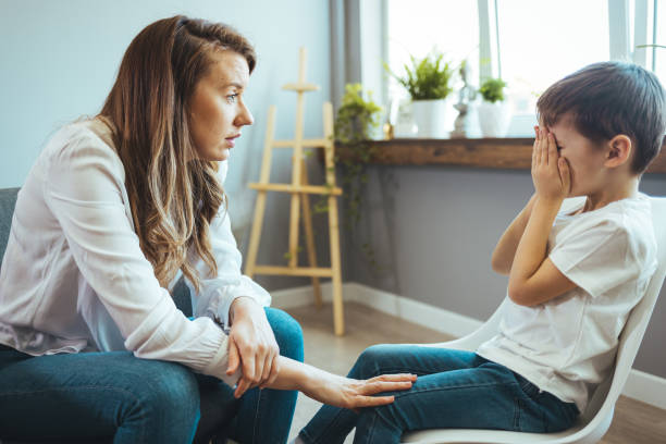 istock Young boy having therapy with a child psychologist. 1397706144