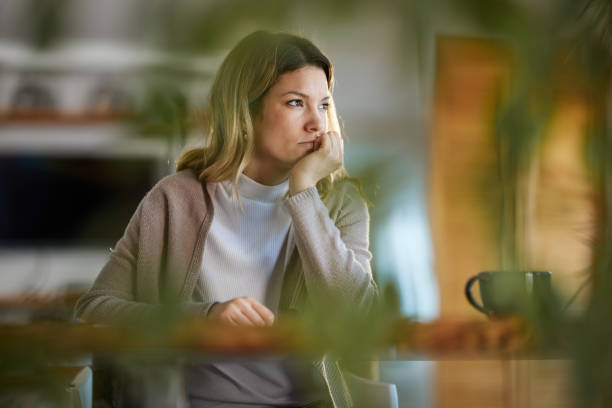 istock Pensive woman at home. 1397708740