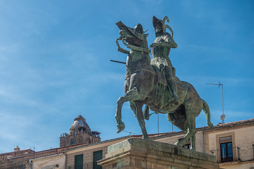 Trujillo, Spain - 16th April 2022. Equestrian statue representing the 'Conquistador of Peru', Francisco Pizarro, in the Plaza Mayor of Trujillo, Extremadura, Spain. The statue is by the American sculptor Charles Cary Rumsey 1879 - 1922) and was gifted to Trujillo by his widow in 1929.
