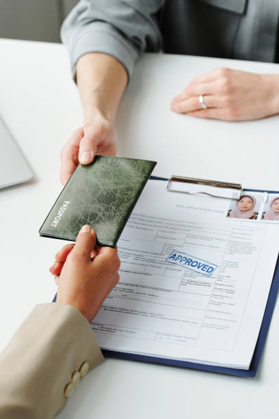istock Giving Passport Back To Woman 1397709418