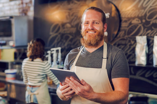 istock Portrait of a young man using a digital tablet while working in a cafe 1397709432