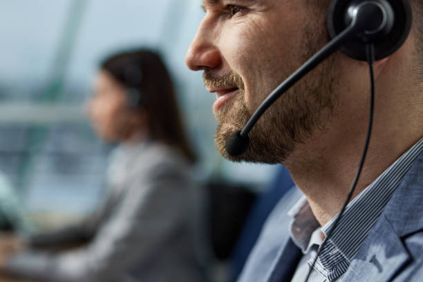 istock Close up of happy customer service representative with headset. 1397709464