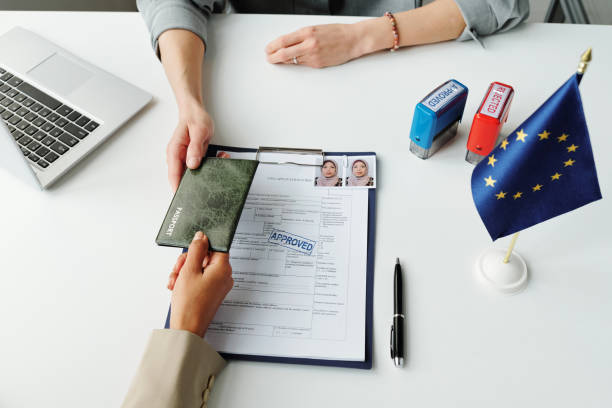 istock Giving Passport To Consular Officer 1397710107