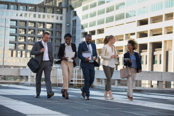 istock Colleagues walking in the city on their way to work 1397712030