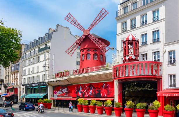 Cabaret "Moilin Rouge" in Montmartre, Paris, France Paris, France - May 2019: Cabaret "Moilin Rouge" in Montmartre place pigalle stock pictures, royalty-free photos & images