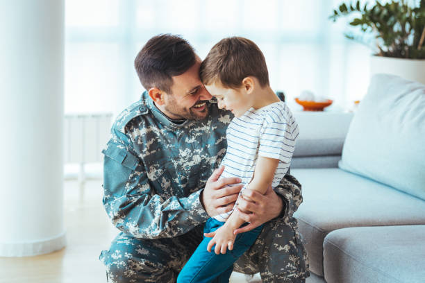 istock Happy soldier play with his son 1397716404