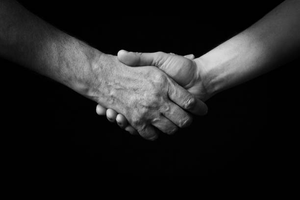 istock Handshake emoji isolated on black background 1397717015
