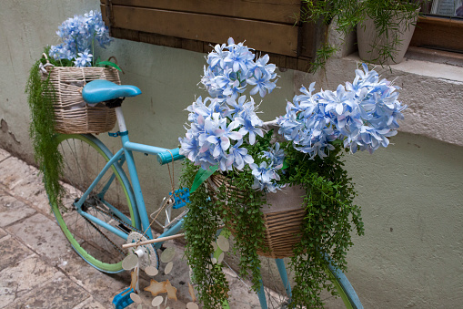 Bicycle with flowers in the street in Budva, Montenegro, Balkans